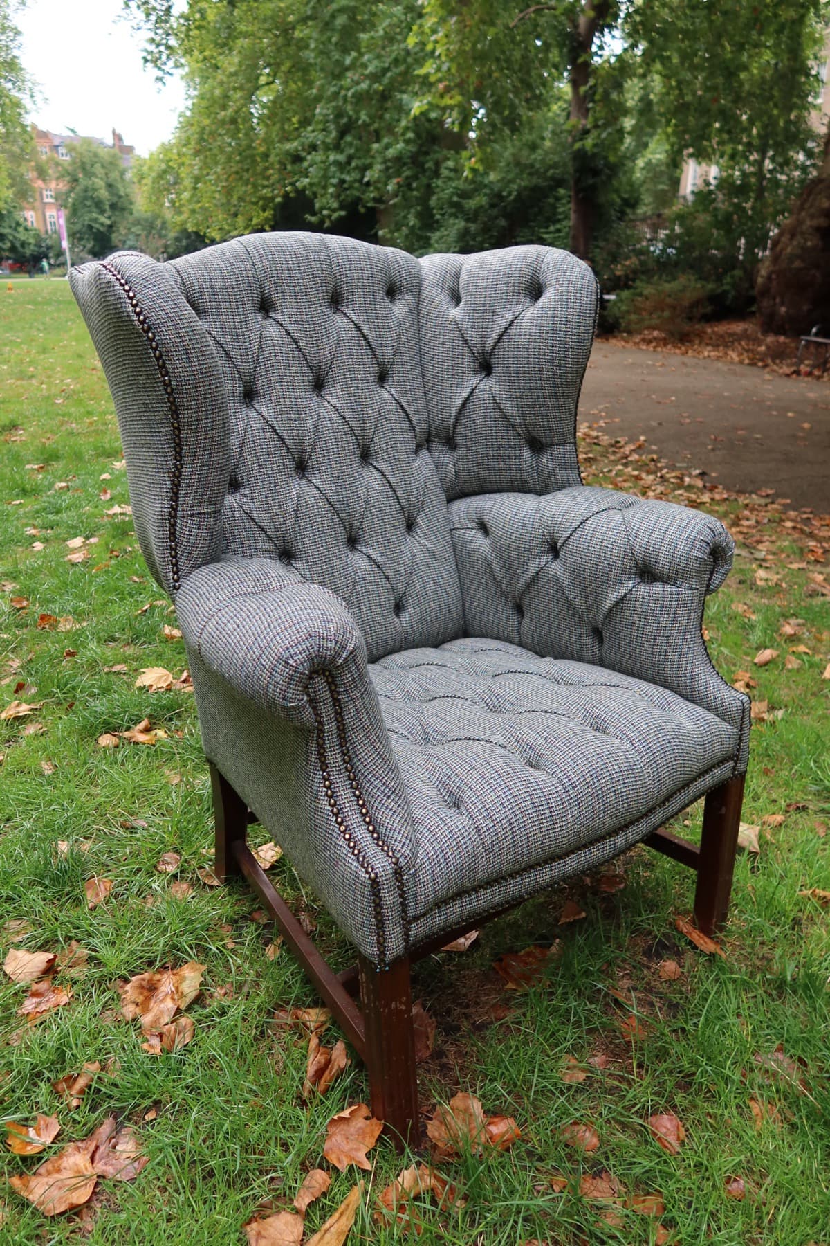 Grey checked armchair reupholstered by Kennington Upholstery