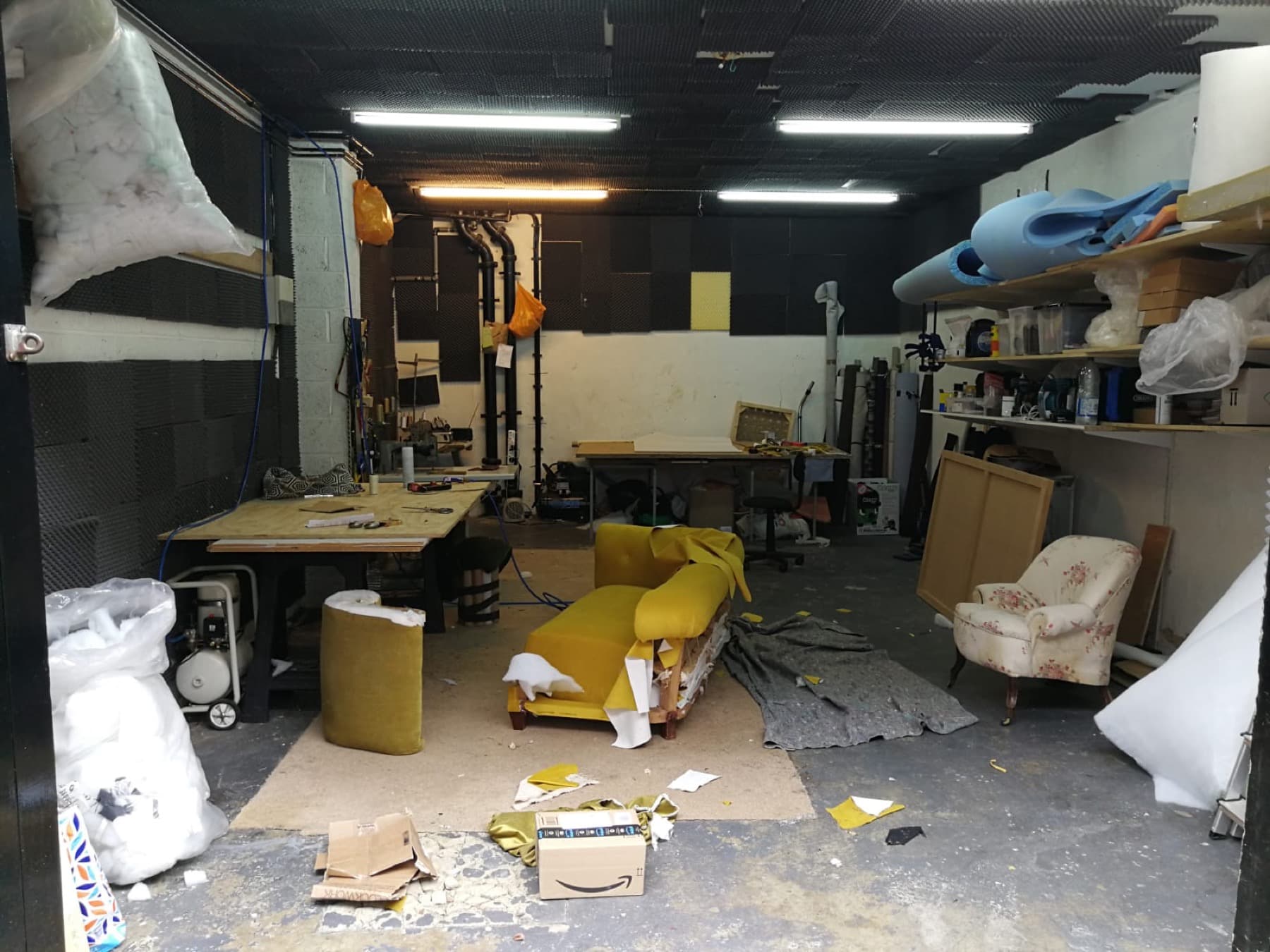 Sofa reupholstery in progress at a London workshop